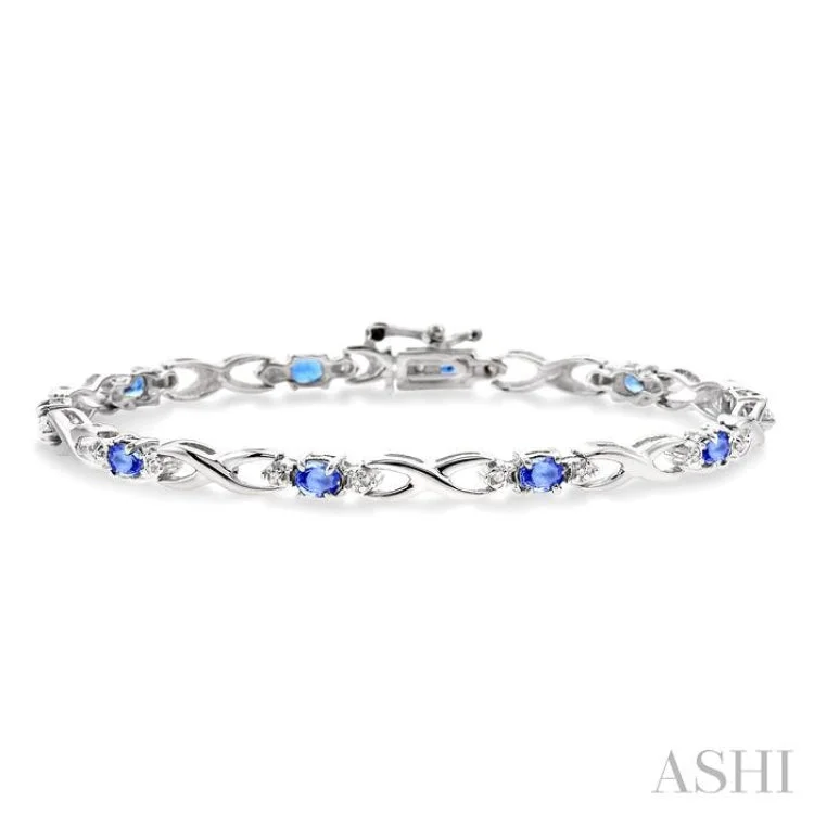 4x3mm Oval Cut Tanzanite and 1/10 Ctw Single Cut Diamond Bracelet in 10K White Gold