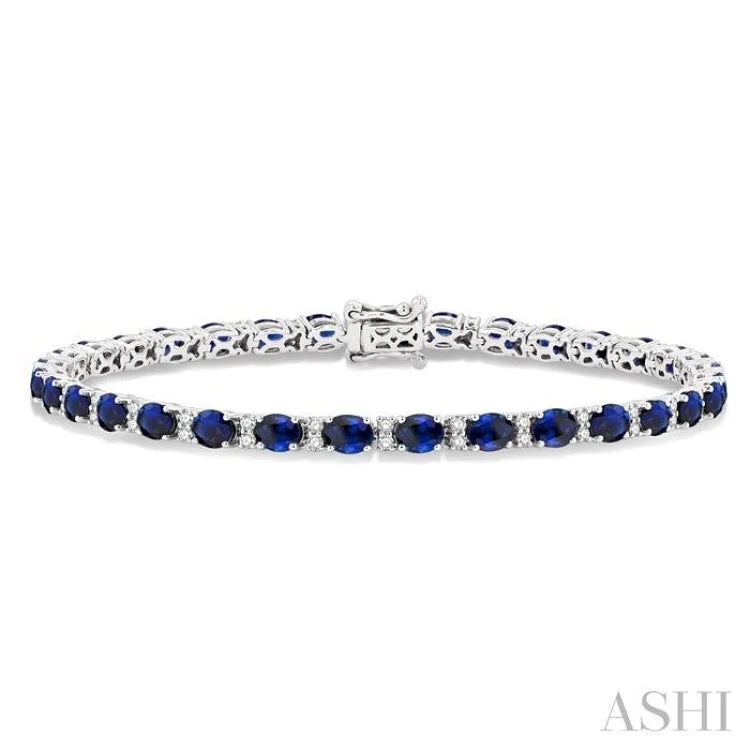 5/8 ctw Round Cut Diamond and 4X3MM Oval Cut Sapphire Precious Bracelet in 14K White Gold